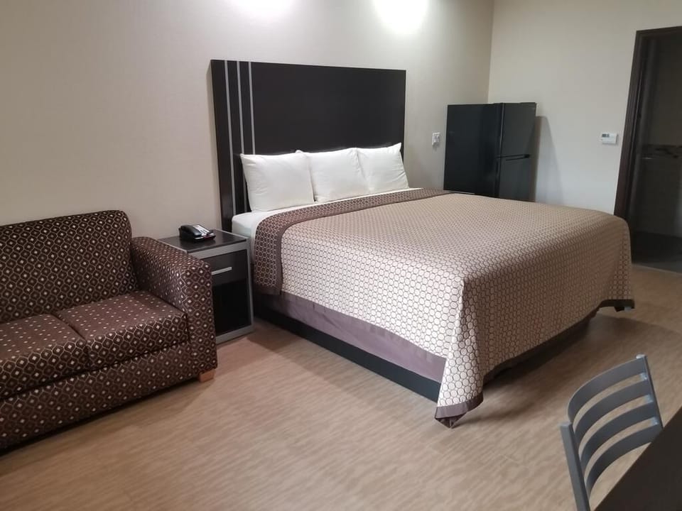 Relax in a roomy suite with sofa and plush bed.
