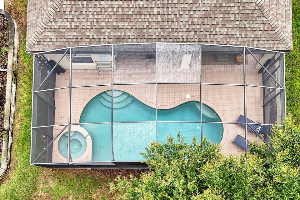 Aerial view of the private screened pool and spa