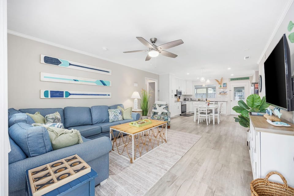 The open-concept design seamlessly connects to the kitchen and dining area.