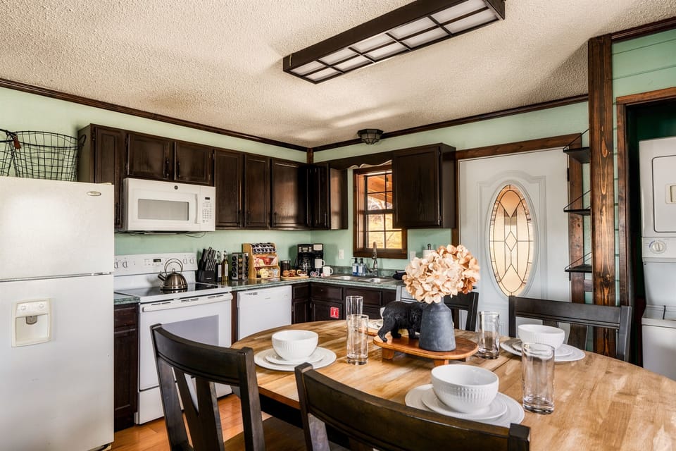 Cook with ease in the fully equipped kitchen—complete with fridge, range, microwave, and dishwasher