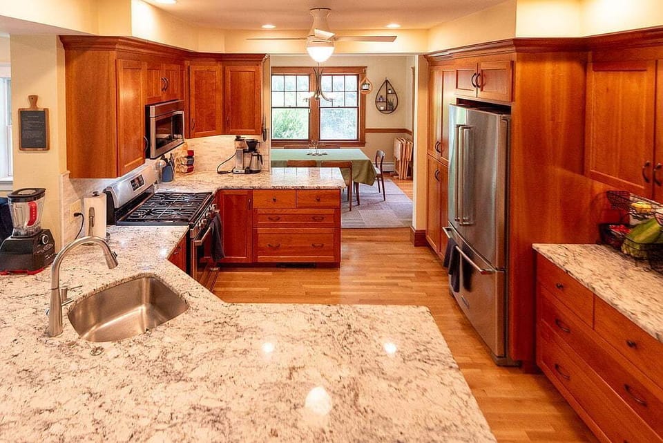 Kitchen opens to dining room, with pass-through countertop.