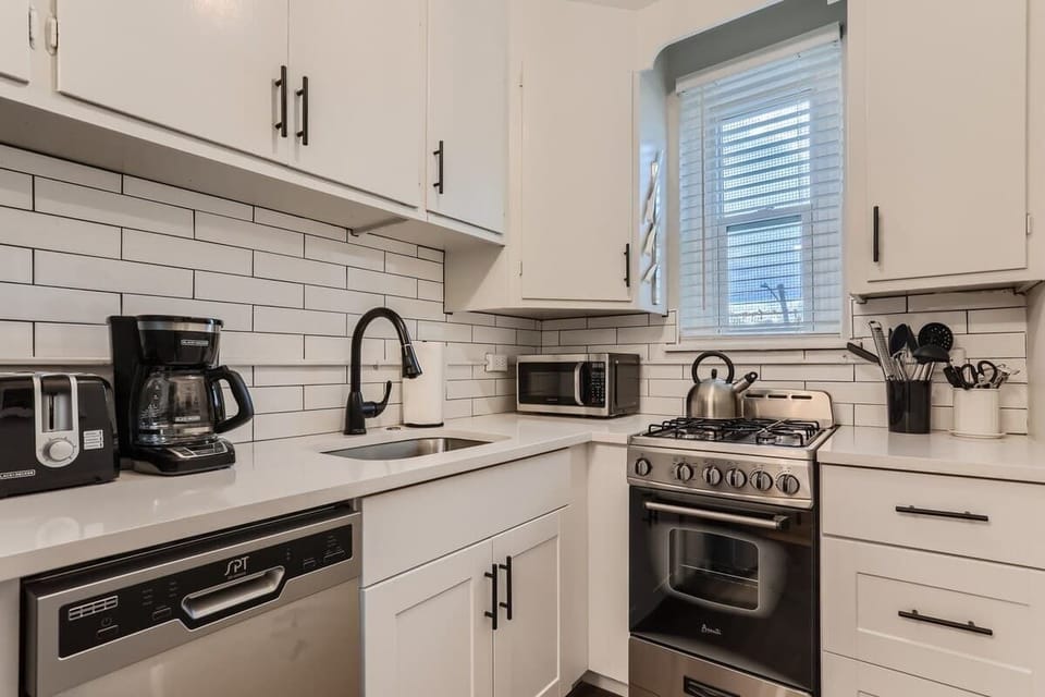 Sleek and modern aesthetic in the renovated kitchen 