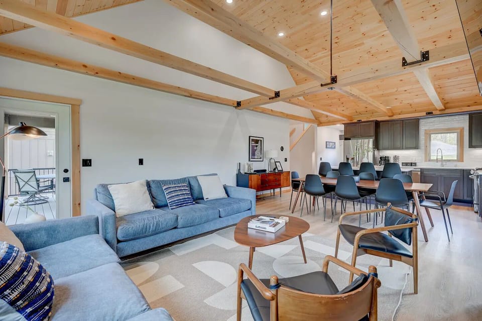 Room to accommodate two families or large groups, with easy access to the deck.