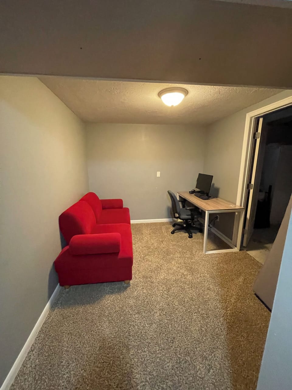 Desk with monitor in the downstairs sitting room