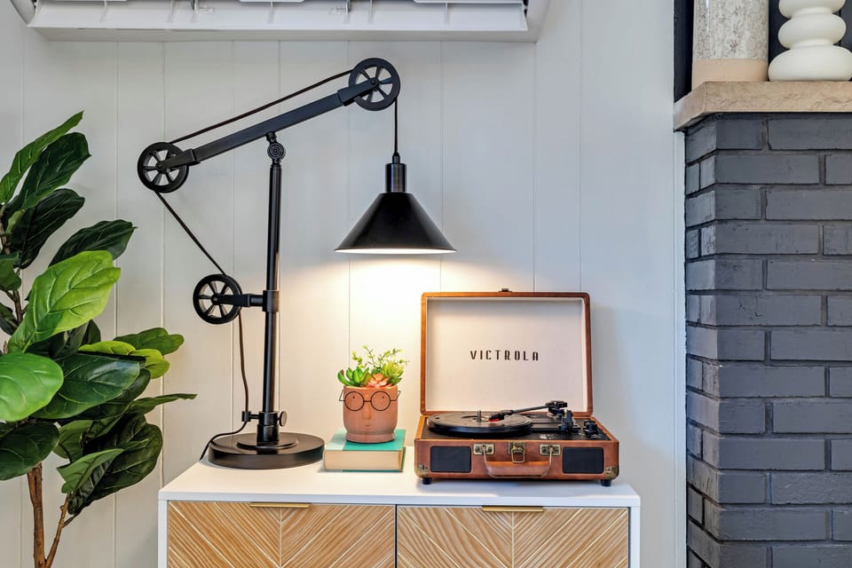 living room: gas fireplace (remote operated), 65" Smart TV, record player