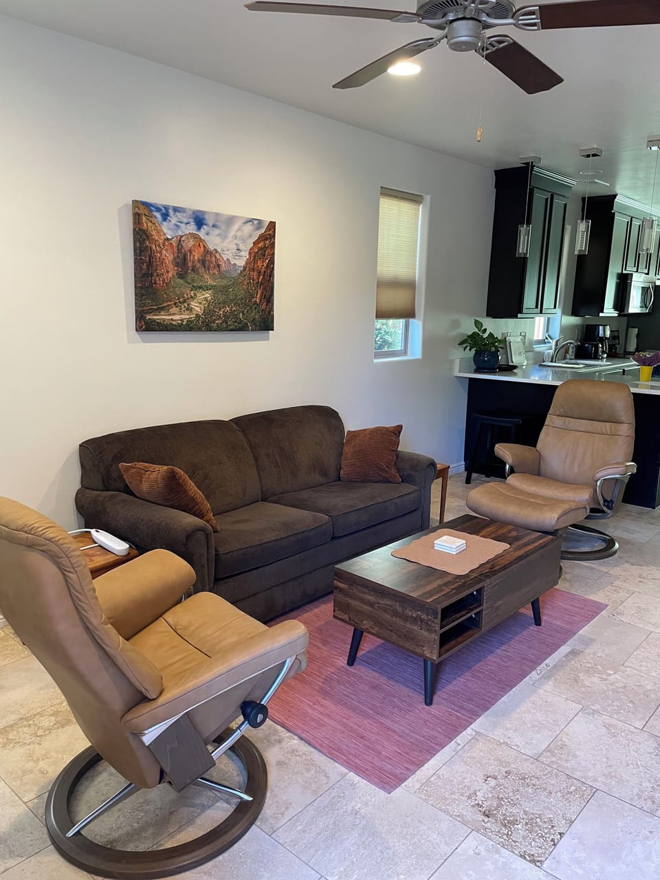 Living room with sofa and two stress-less leather chairs