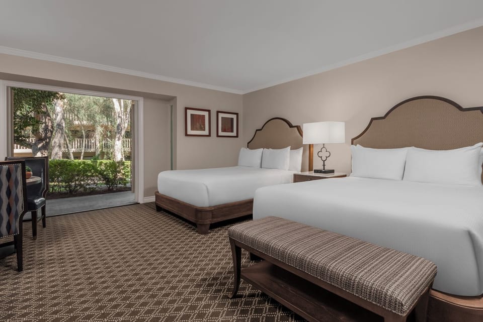Stretch out on crisp linens in a calm, roomy retreat.