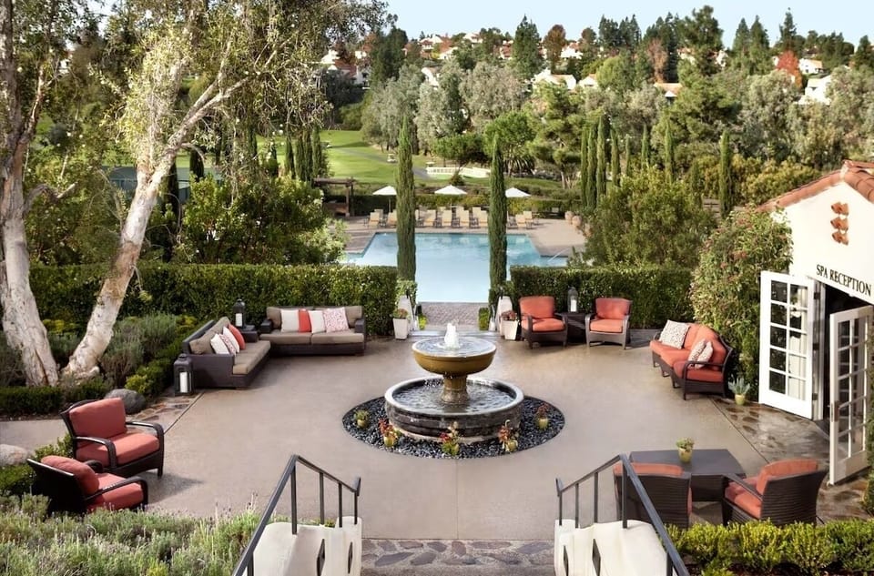 Gather around the fountain and savor peaceful garden views.