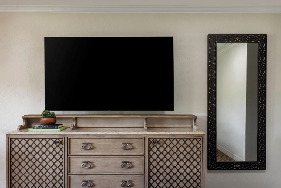 Kick back with effortless entertainment on a sleek, large TV.