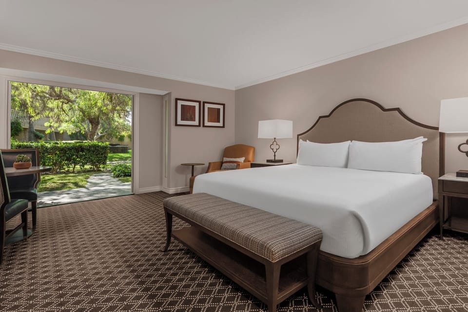 Sink into plush comfort and wake to serene courtyard greenery.
