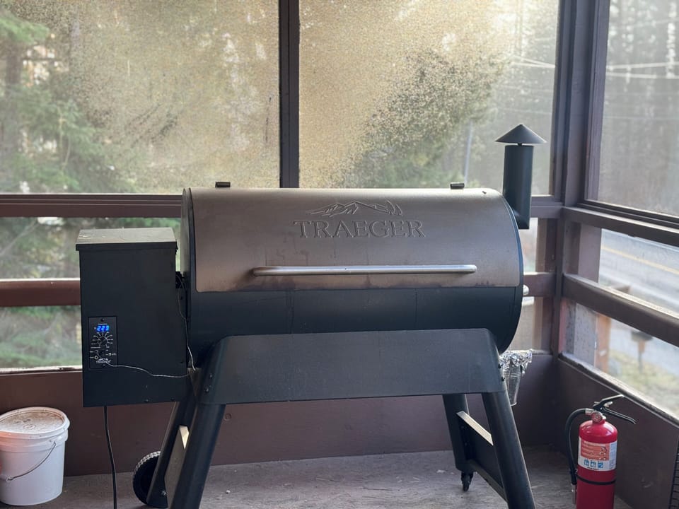 Traeger smoker on screened patio