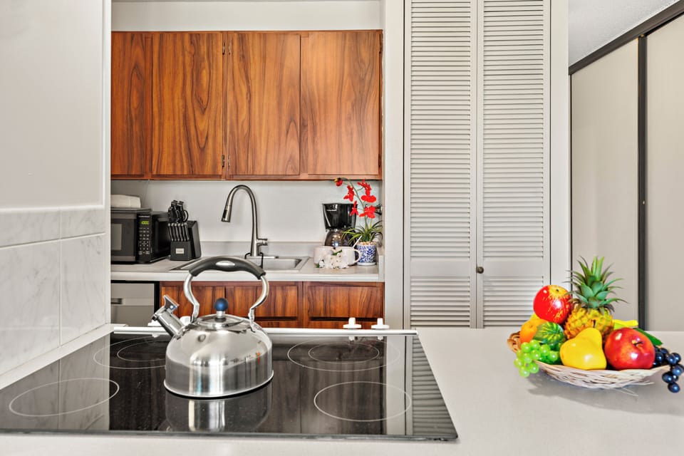 Drip coffee maker, kettle, and dishware provided