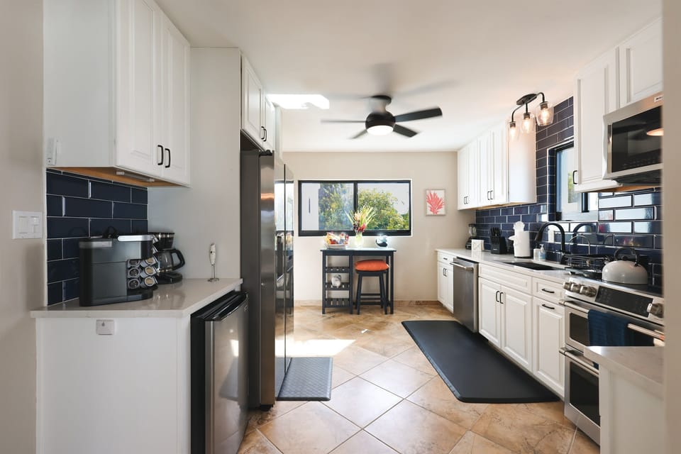 Gourmet kitchen featuring sleek countertops and modern appliances.
