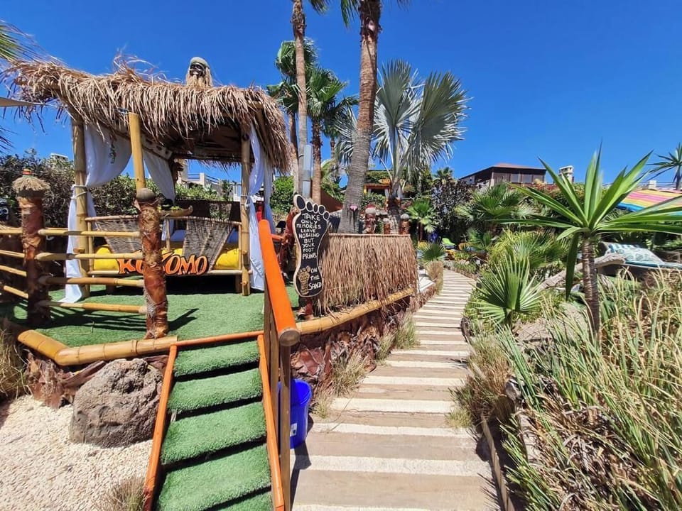 The thatched siesta bed facing the beach.