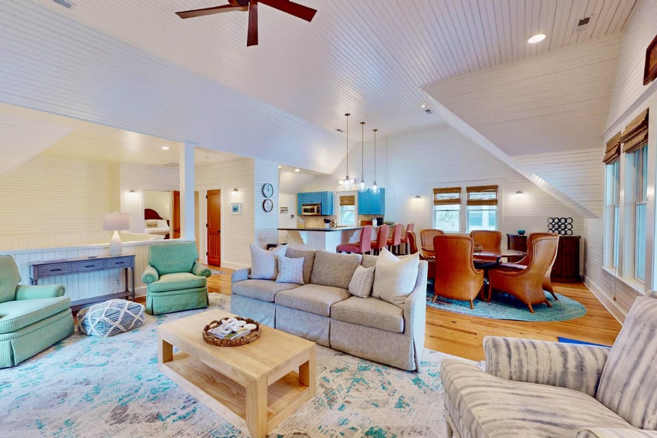 This house features an open concept living room, dining room and kitchen
