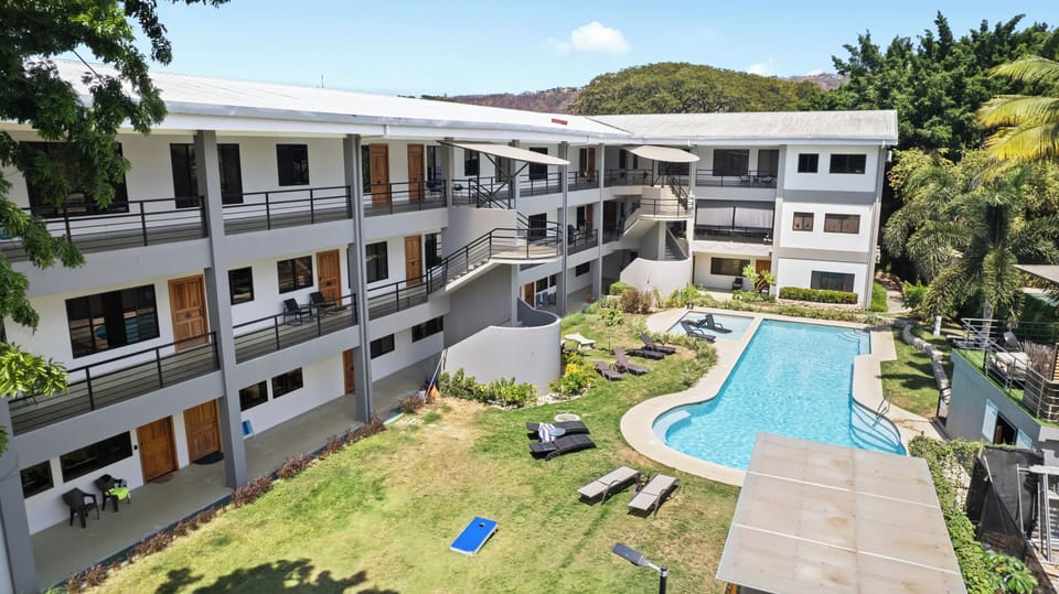 Paradizio is a tranquil oasis just steps from the beach!  Enjoy amenities like a large pool, lounge areas, BBQ pavilion plus gated entry and parking!