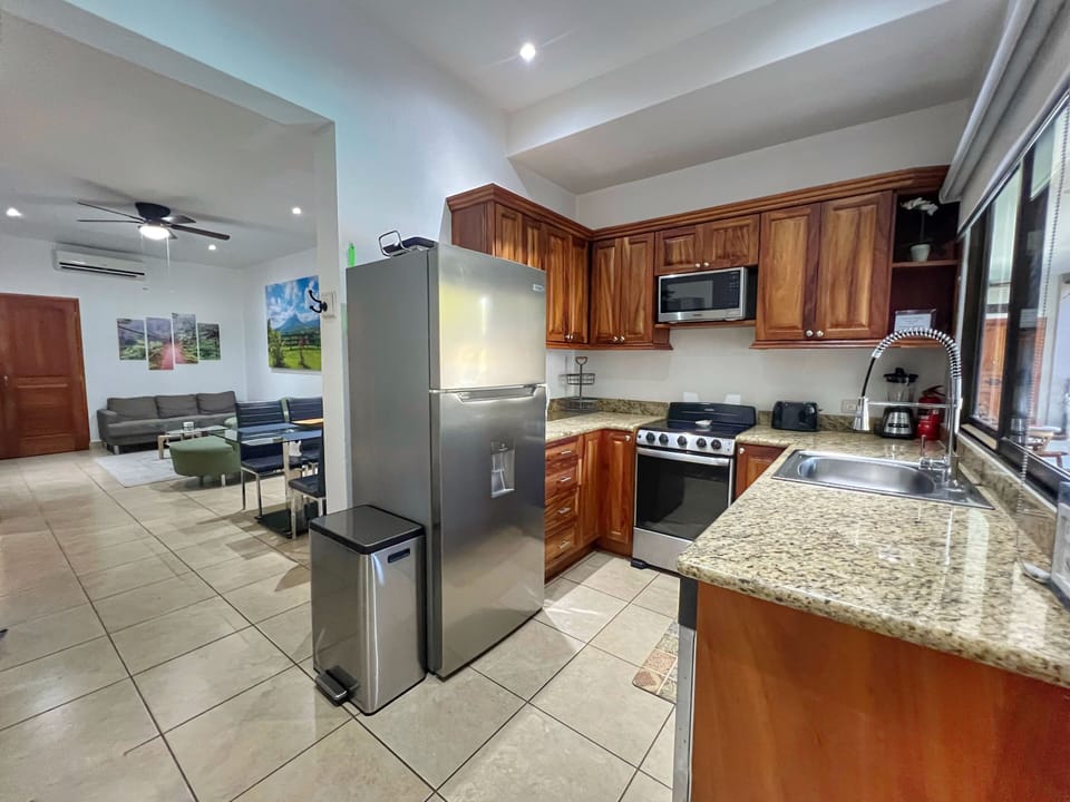 The condo has a well-equipped kitchen just inside the front door, then flows into the dining & living space.  
