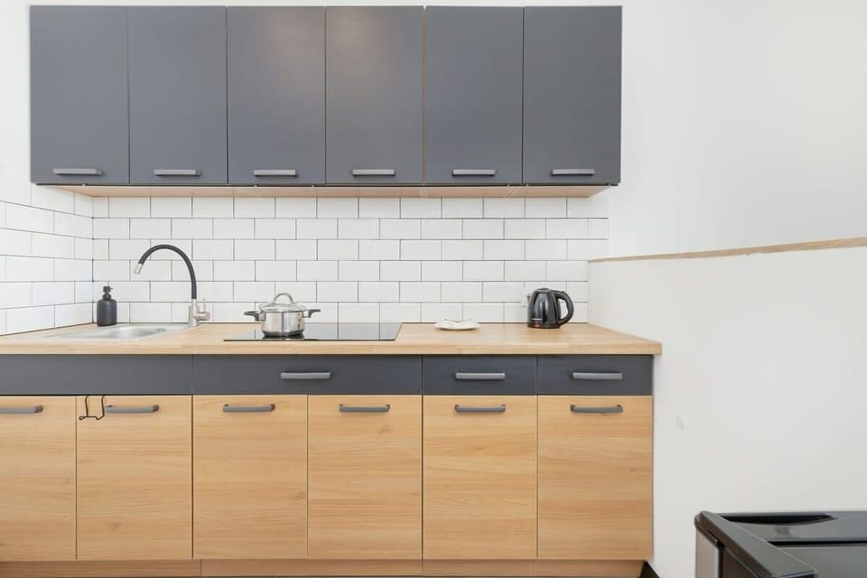 The sleek, fully equipped kitchenette with dining area.