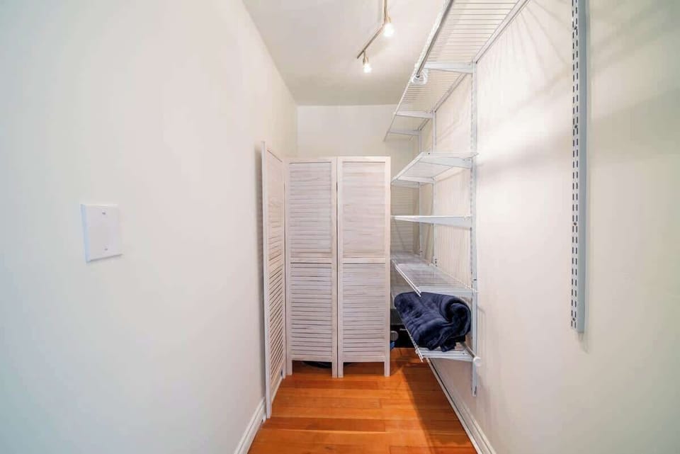 Spacious walk-in closet with shelving and storage, perfect for organizing your belongings.