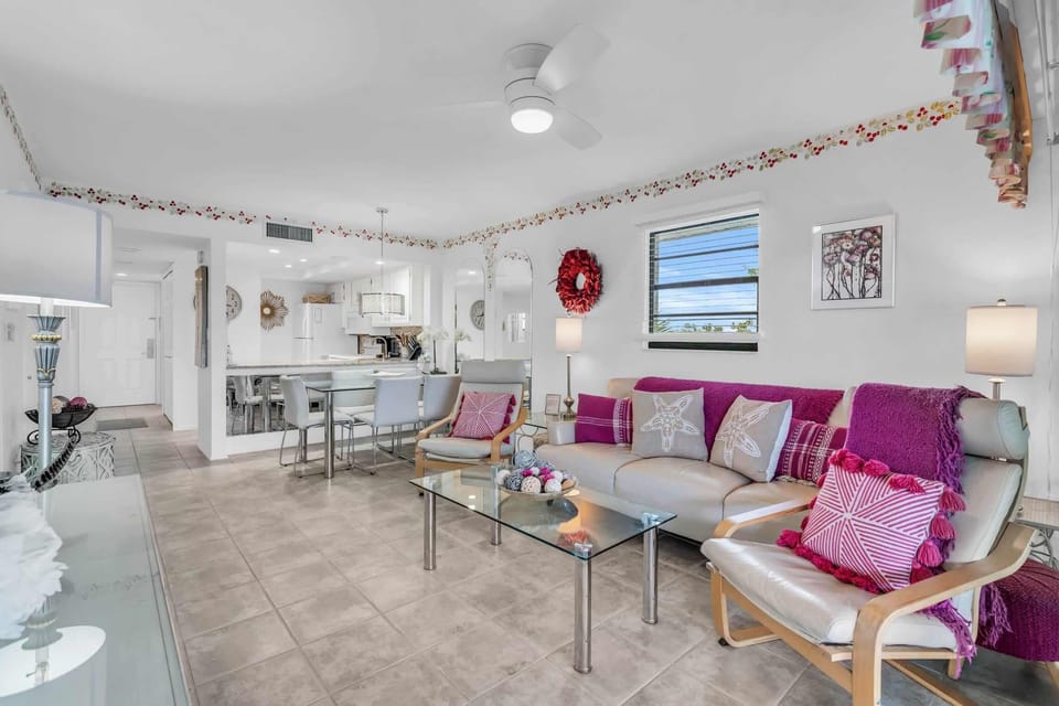 There is a fuchsia theme throughout the condo