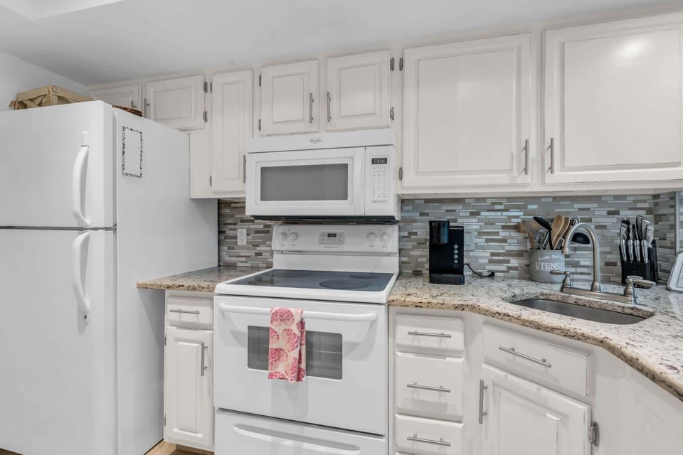 The kitchen in the condo is fully equipped and it has granite counters