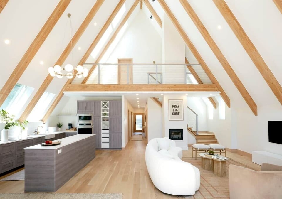 The Great Room. Gentle light filtering through 30ft vaulted beams