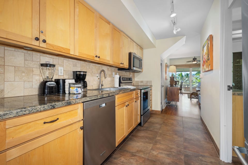 Your private kitchen features granite counters, stainless appliances, and everything needed to prepare meals—coffee makers, blender, and toaster await your morning rituals.