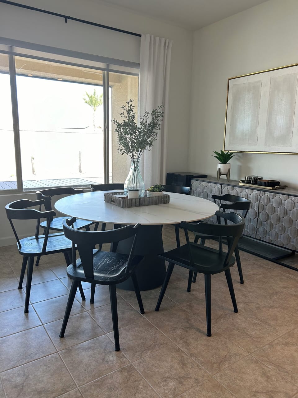 Dining table,chairs for 7. Could fit 8.
Wine fridge in corner.