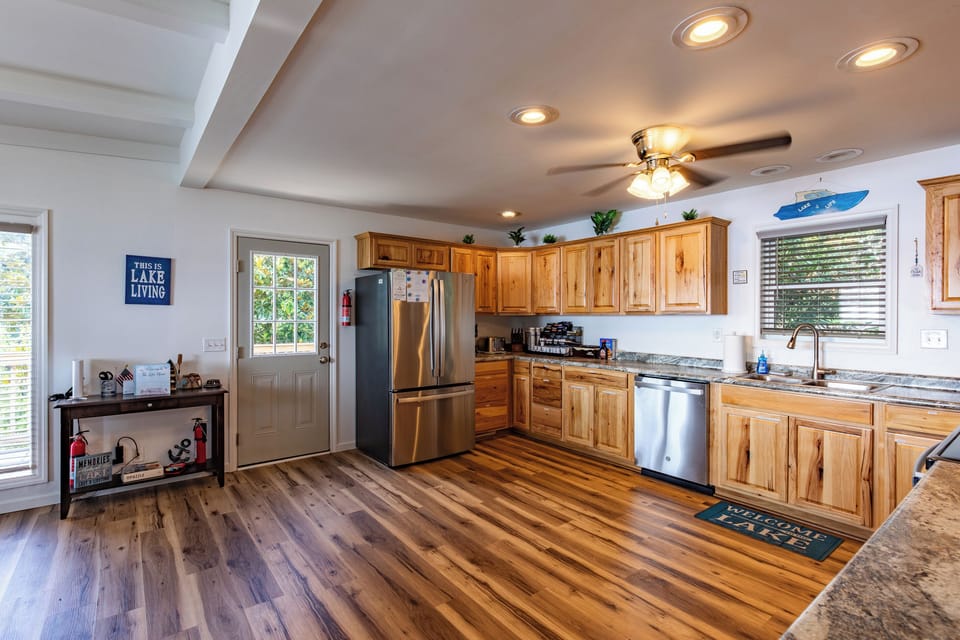 The fully equipped kitchen offers full-size appliances, generous counter space, and room to cook for a crowd.
