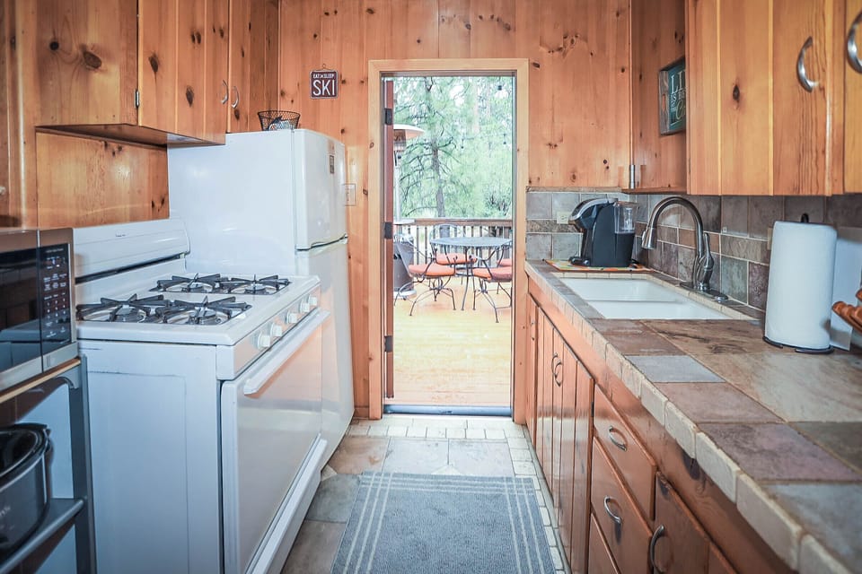Refrigerator/freezer, pots/pans, dishes & untensils, wine glasses and beer pints... and did we mention nature just outside the door?