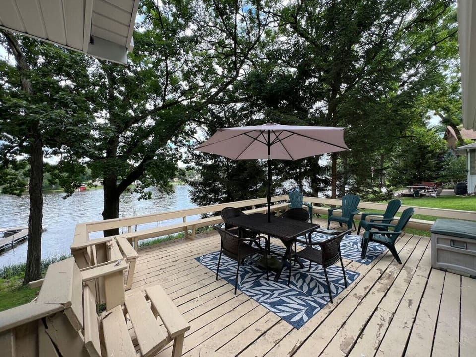 Beautiful and spacious deck with large grill and plenty of seating overlooking the water.