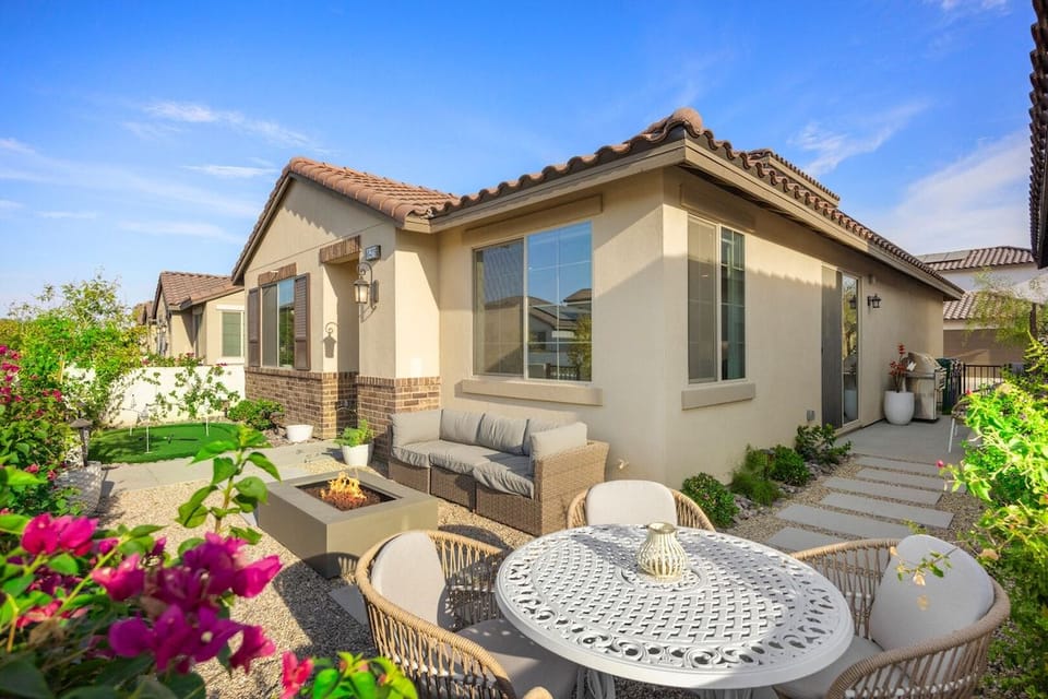 Private backyard patio with dining area surrounded by desert blooms all around you.