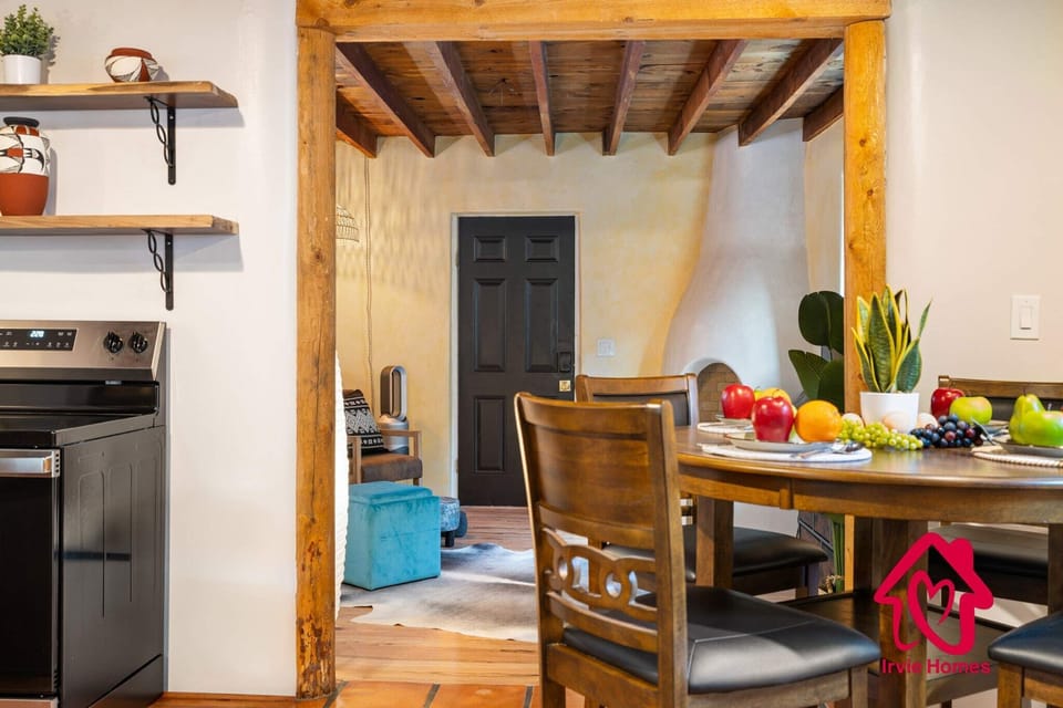 Cozy dining area with rustic kitchen features.