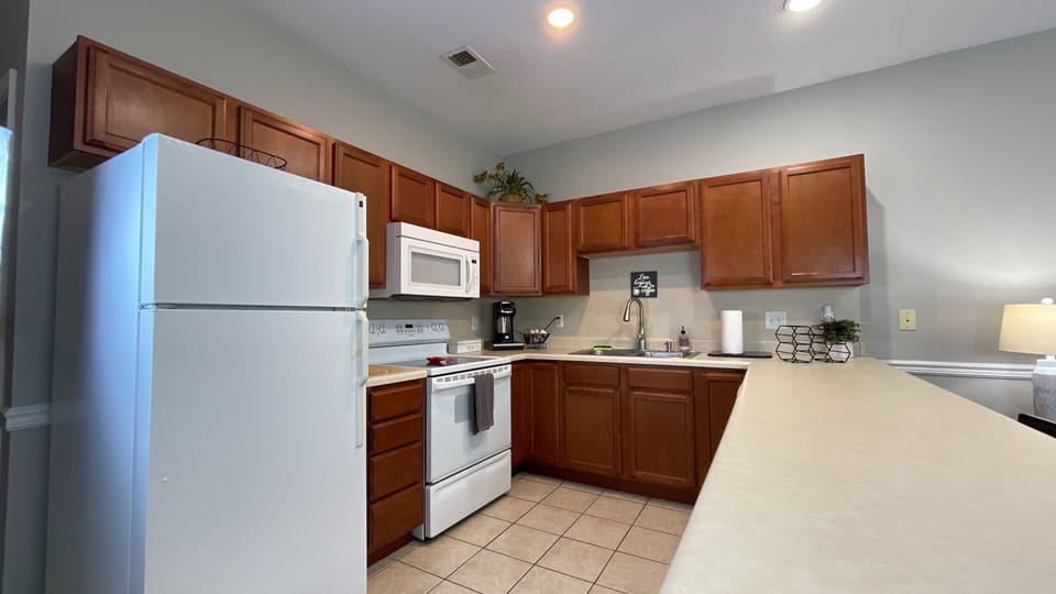Feel at home in our inviting kitchen, complete with a fridge, oven, and everything you need to whip up delicious meals!