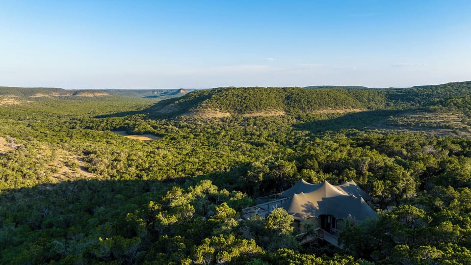 The home is tucked into the Hill Country landscape