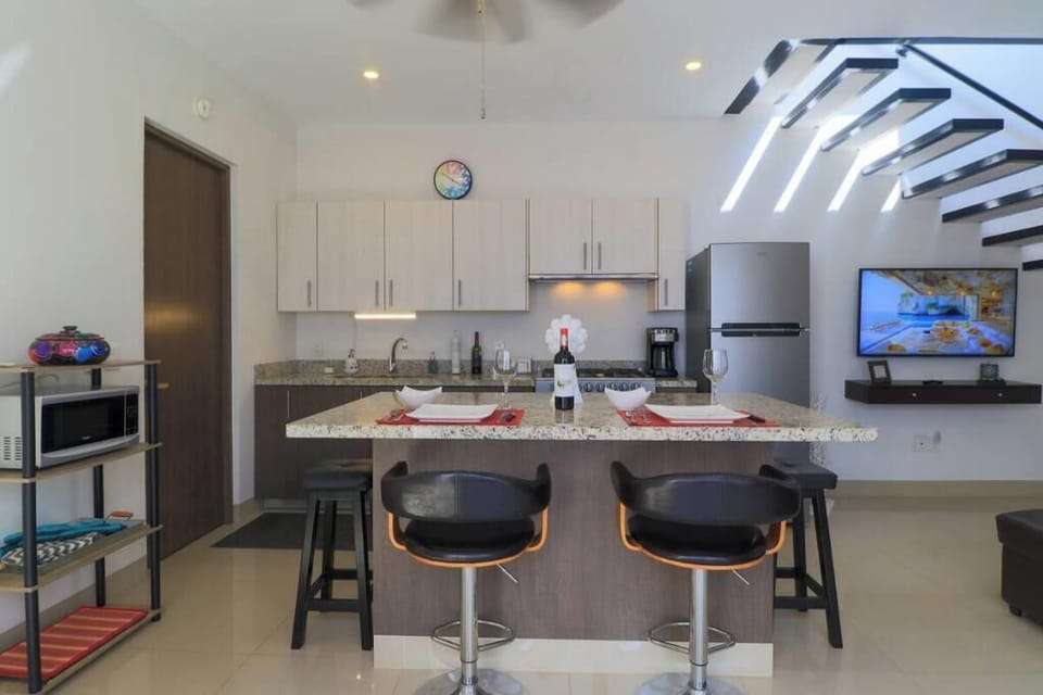 Lovely living area, with kitchen island, mini split, double sink, fully equipped