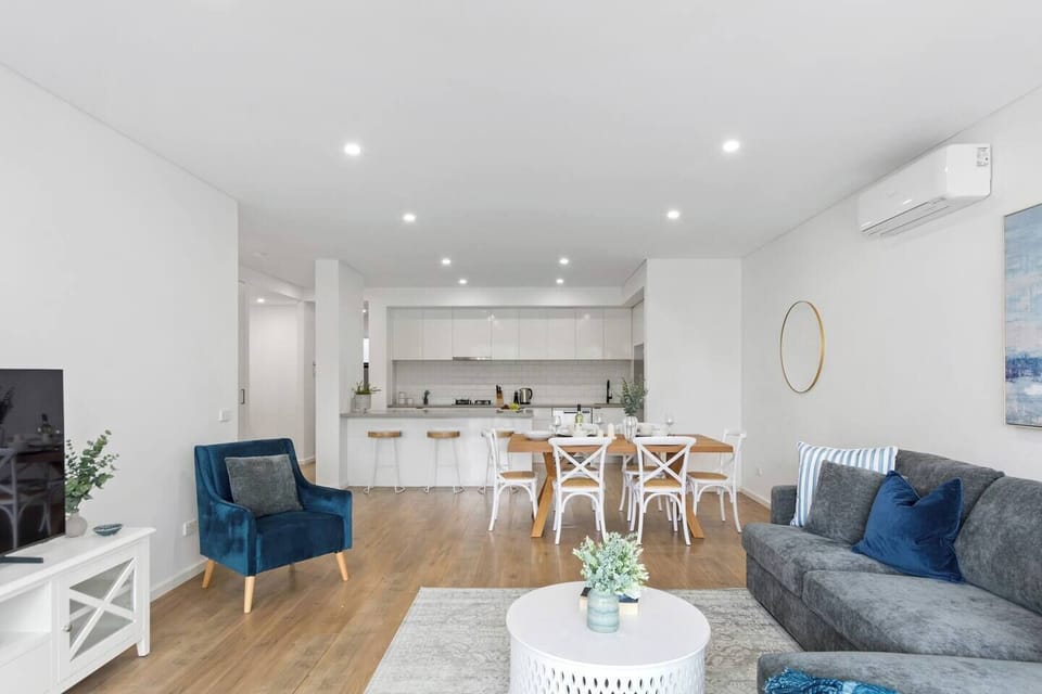 The light-filled living area includes a sofa and chaise to settle in with a movie, while split system air conditioning and heating ensure year-round comfort. 
