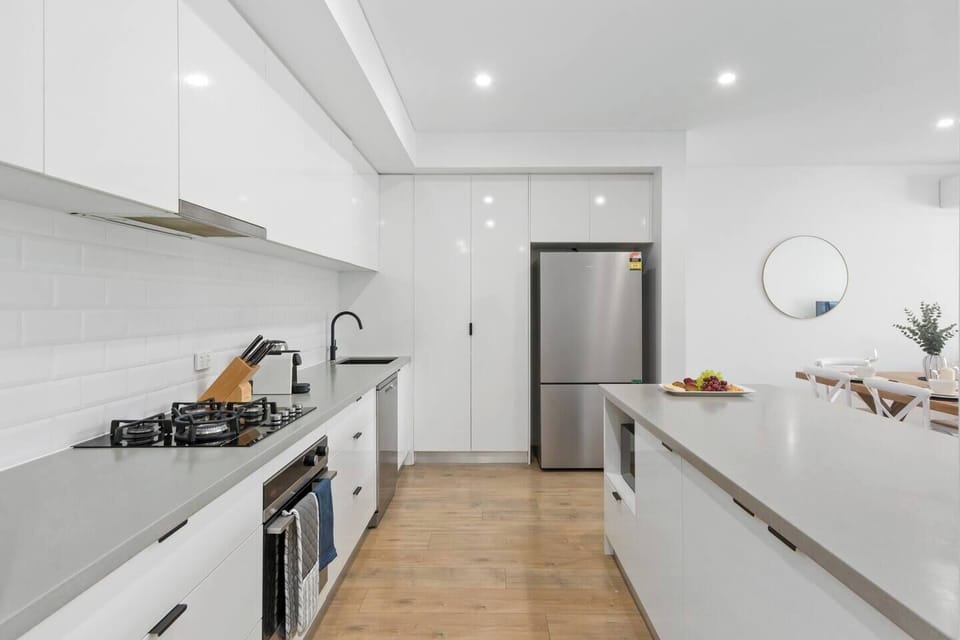 A modern and spacious kitchen has all you need to cook up a feast, with additional seating at the breakfast bar and a dishwasher for easy clean-up. 
