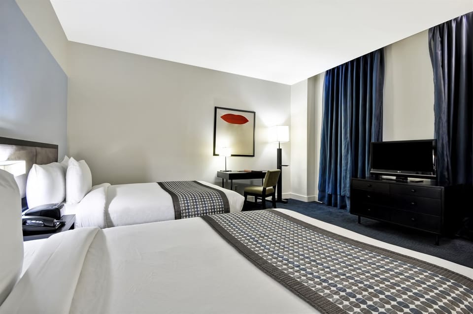 Unwind after adventures with cozy beds and in-room TV.