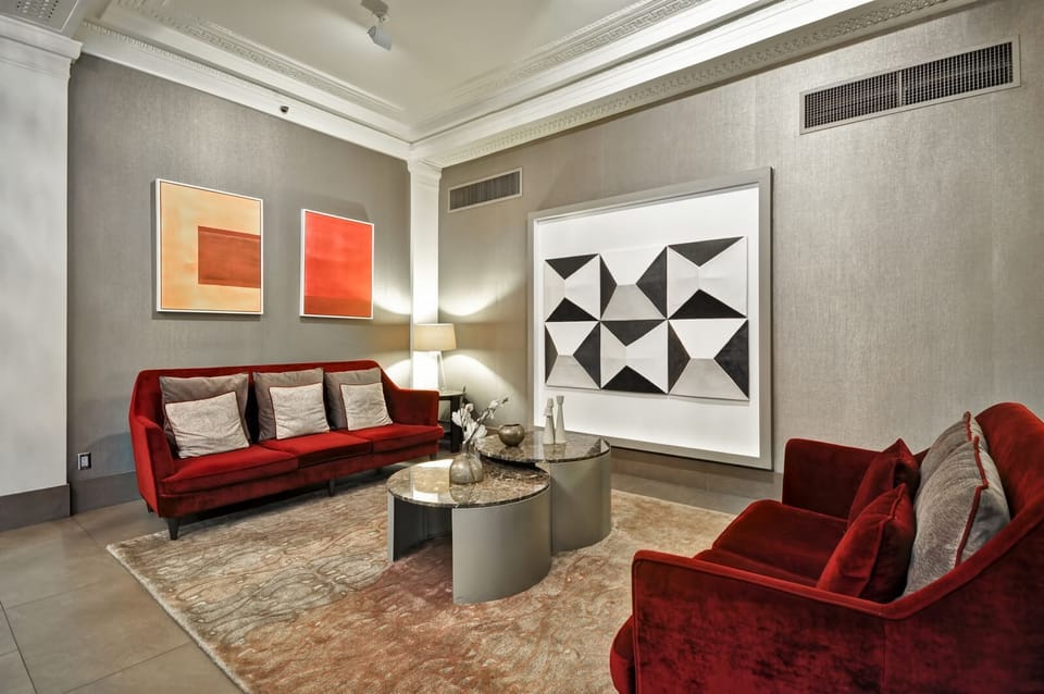 Gather on velvet sofas in a gallery-like lounge for cocktails.