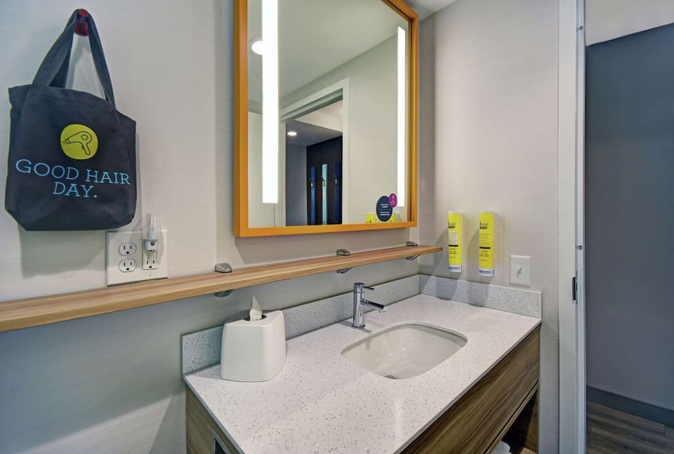 Refresh at the bright vanity with ample counter space.