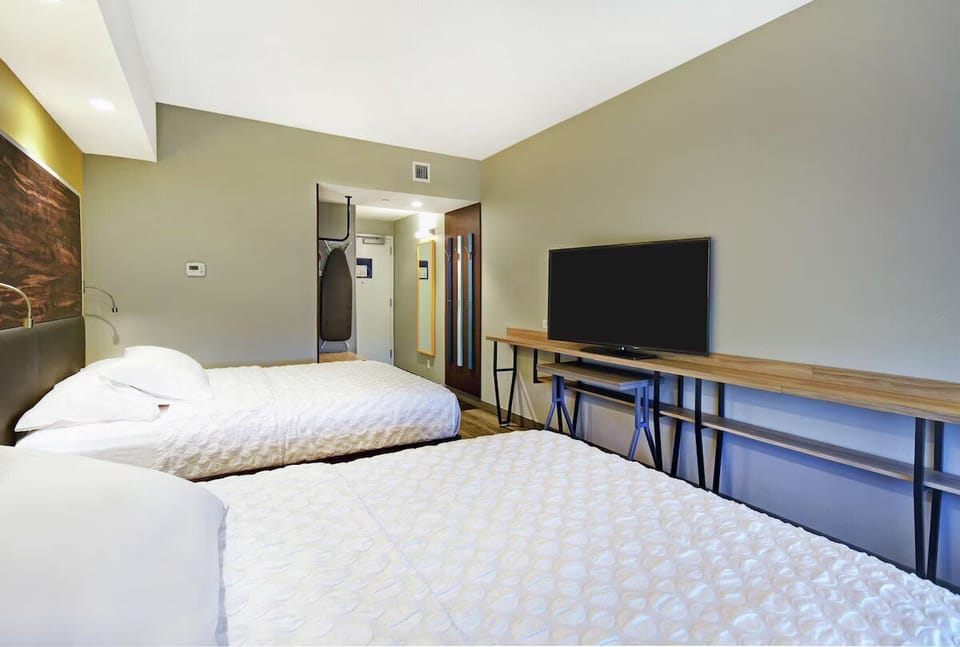 Kick back with big-screen entertainment and a roomy work desk.