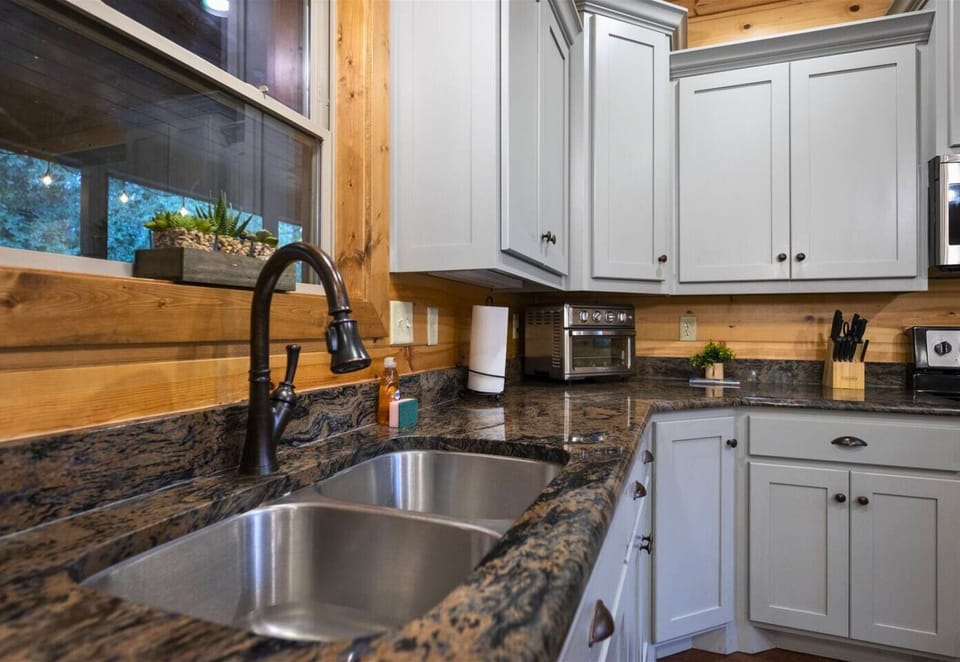 Admire the sleek design of our kitchen sink area, where practicality meets elegance.