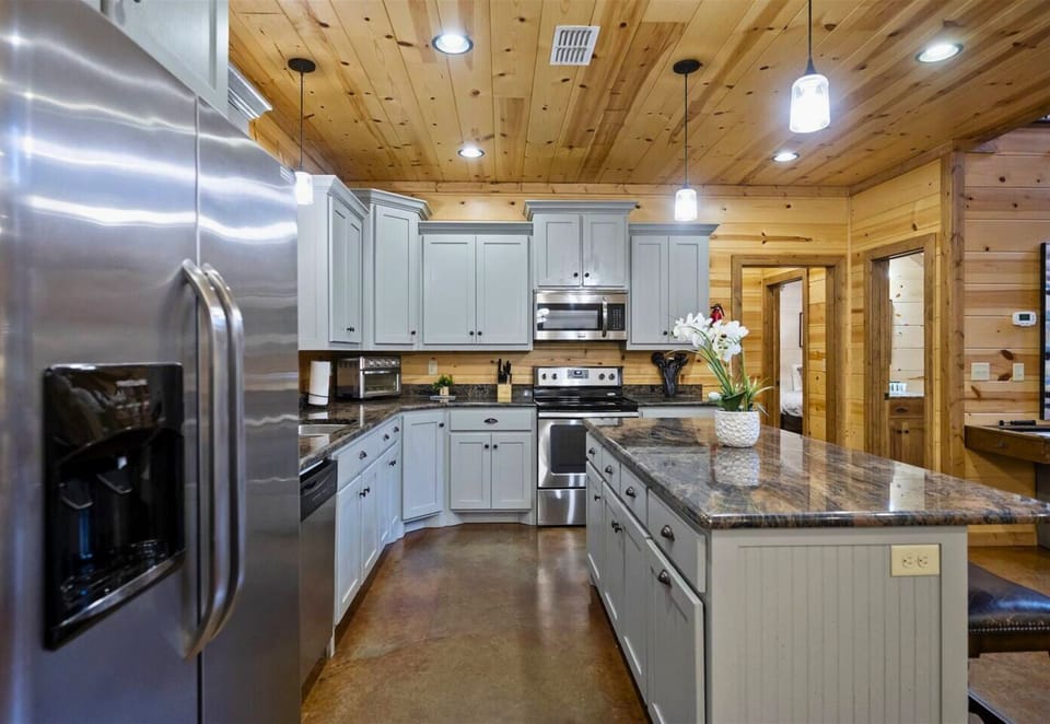 Create delicious dishes in this spacious kitchen, designed for both style and functionality.