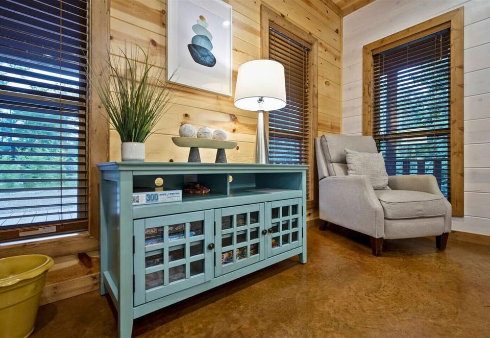 Brighten your day with this charming nook, featuring a vibrant blue cabinet for added flair.