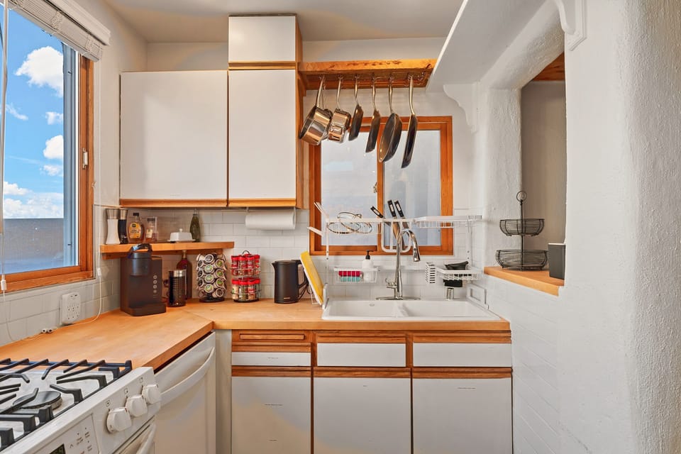 Fully stocked kitchen, with the coffee setup on the counter.