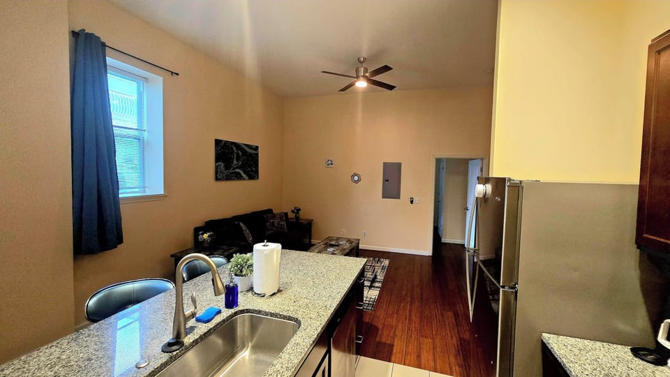 The kitchen features spacious countertops, offering ample room for meal prep.
