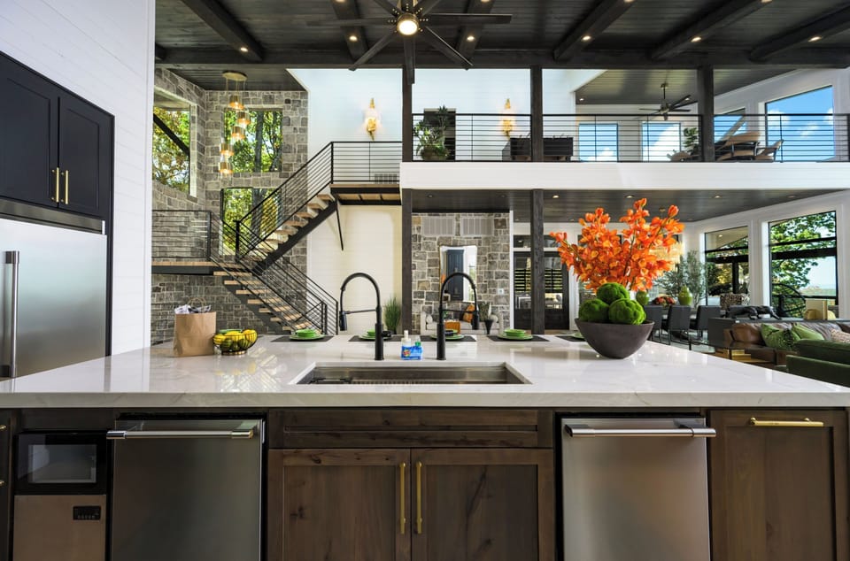 The kitchen is equipped with two dishwashers.