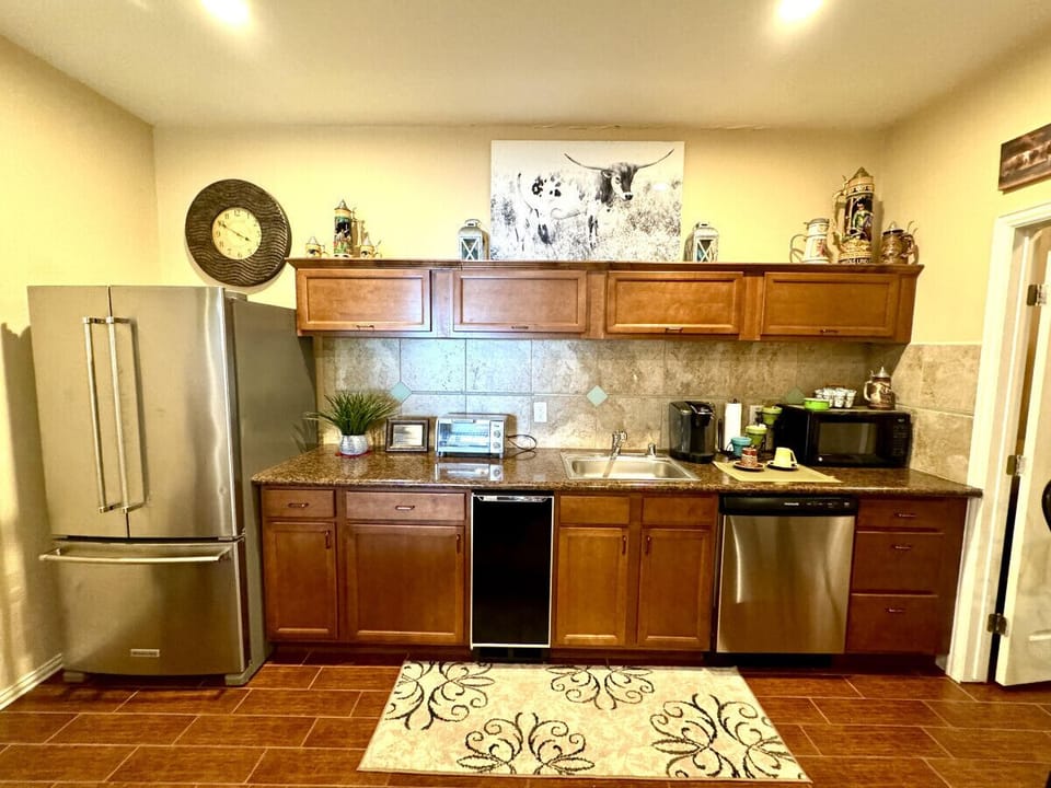 Kitchenette with full-sized refrigerator, beverage cooler, microwave, dishwasher, toaster oven, Keurig coffee maker (private grill on porch). All cookware and utensils provided
