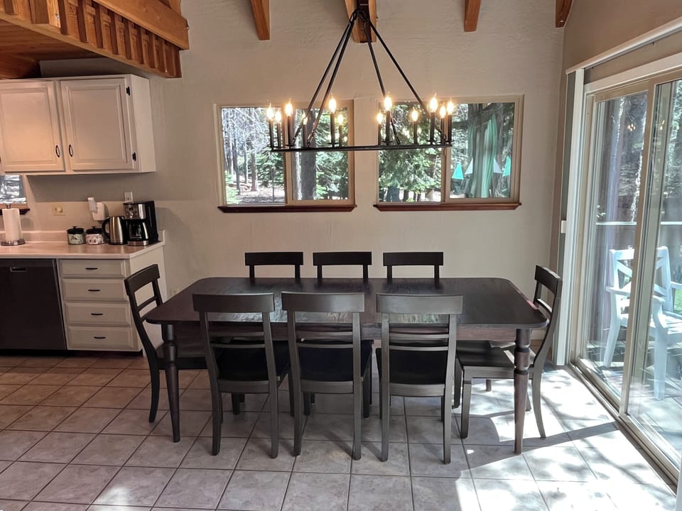 Dining room with forest views, seating for 8, and expandable table
